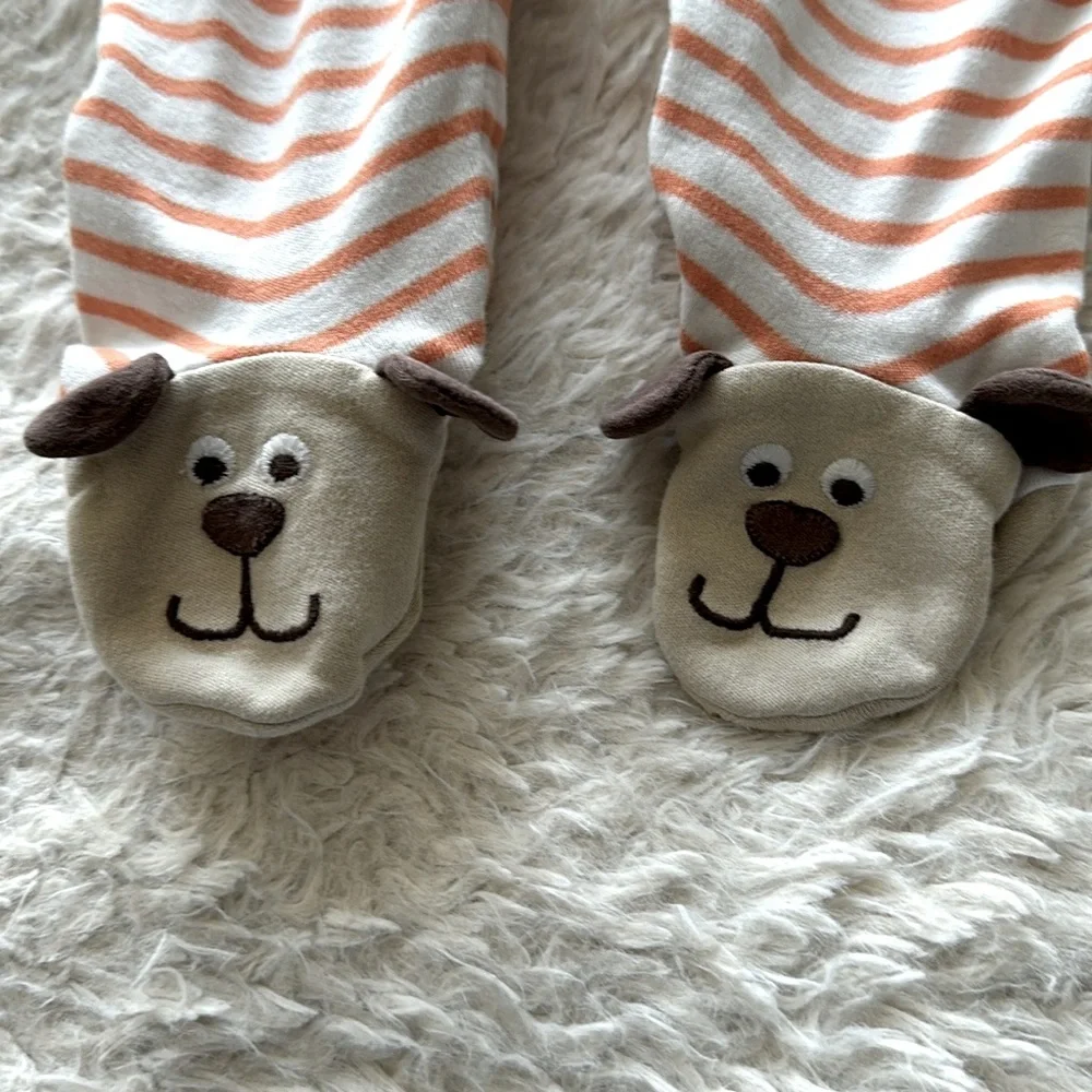 Cute as a button onesie with doggie print